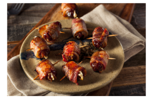image of dish with bacon-wrapped stuffed dates on it