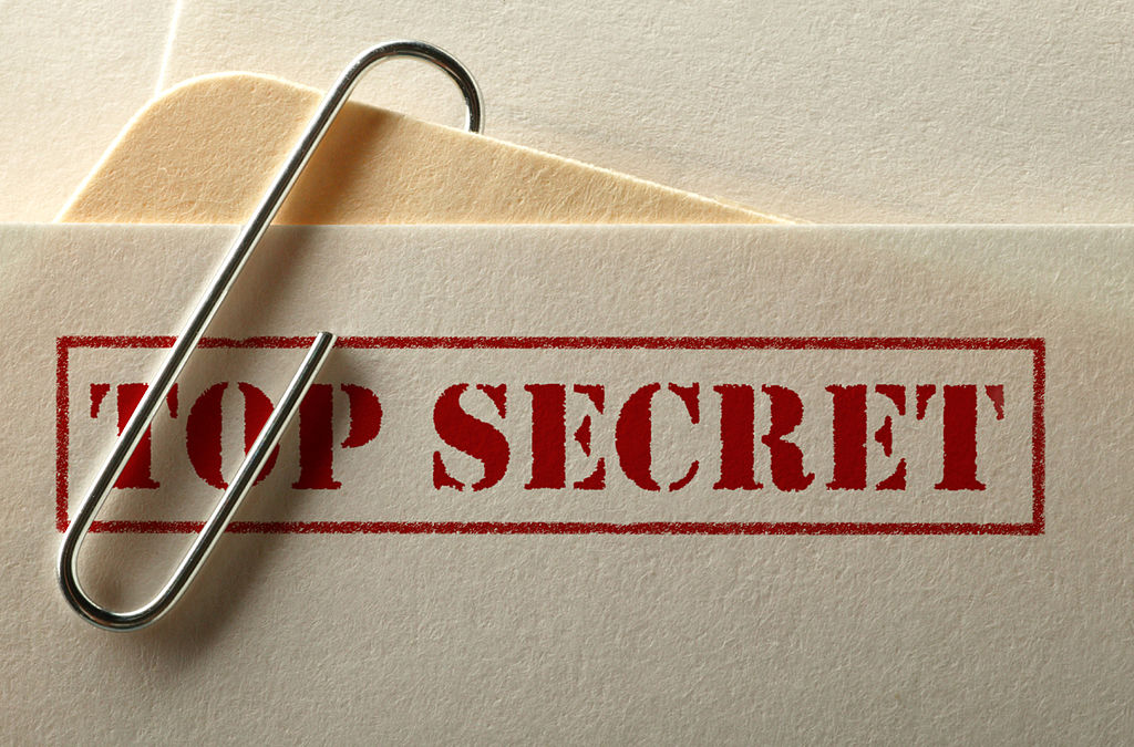 Folders labeled "Top Secret"