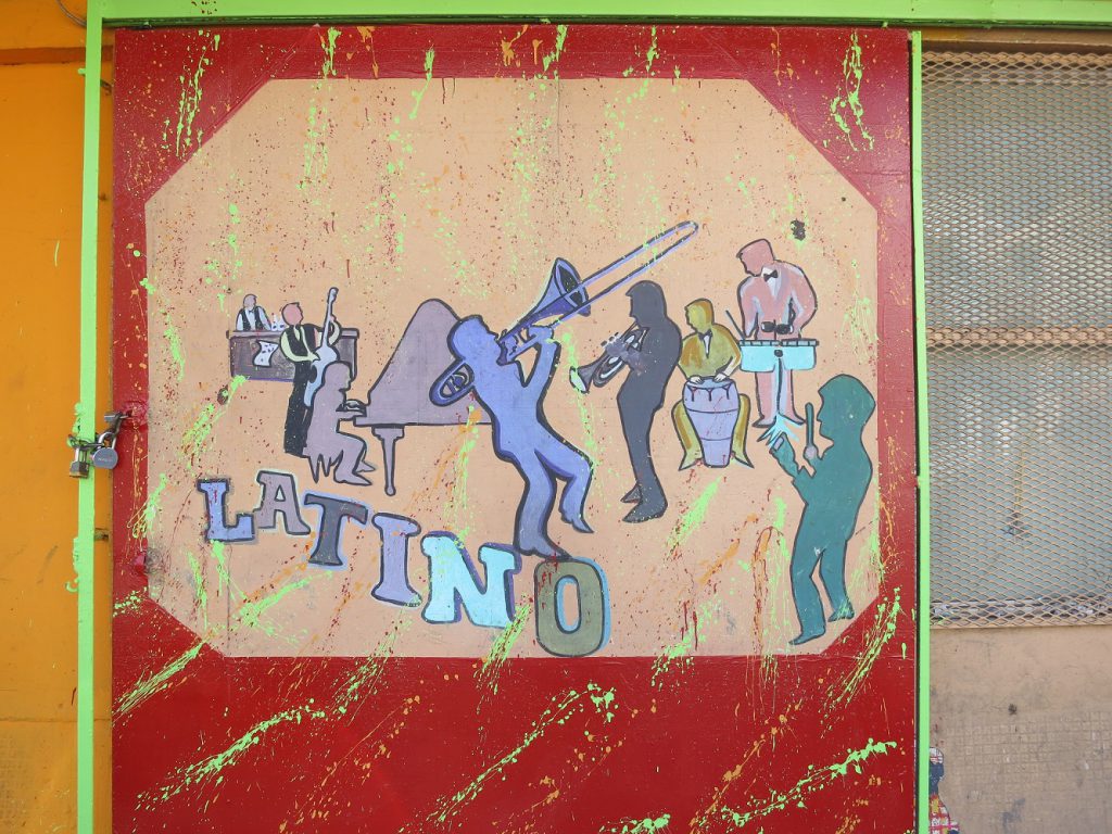 Painted mural of musicians with "Latino" by Paul Sableman, used under CC Attribution License